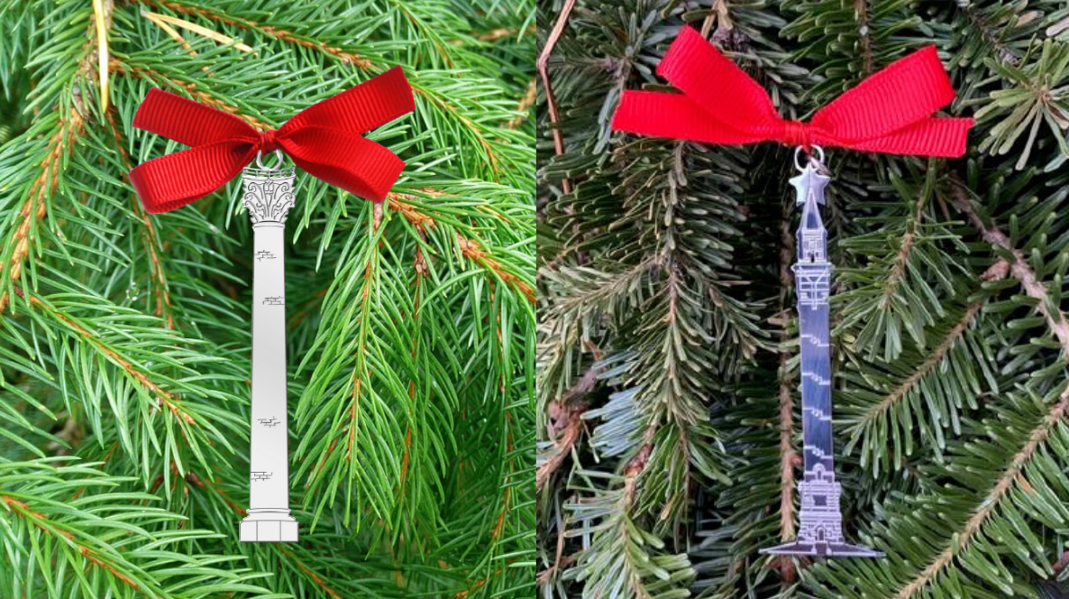 Both water tower ornaments on an evergreen tree